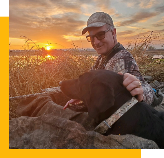 Bill Secord duck hunting with his dog