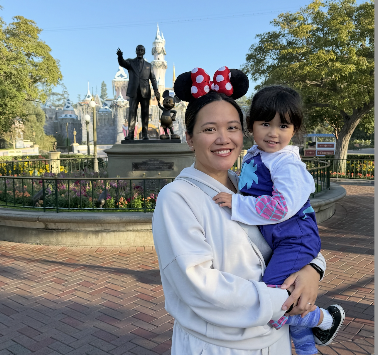 Lucky Corral with Minnie Mouse ears with her daughter at Disney 