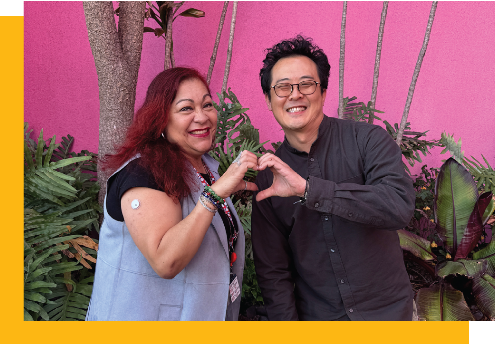 Yolanda (Yolie) Marquez and Mike Huang with pink background
