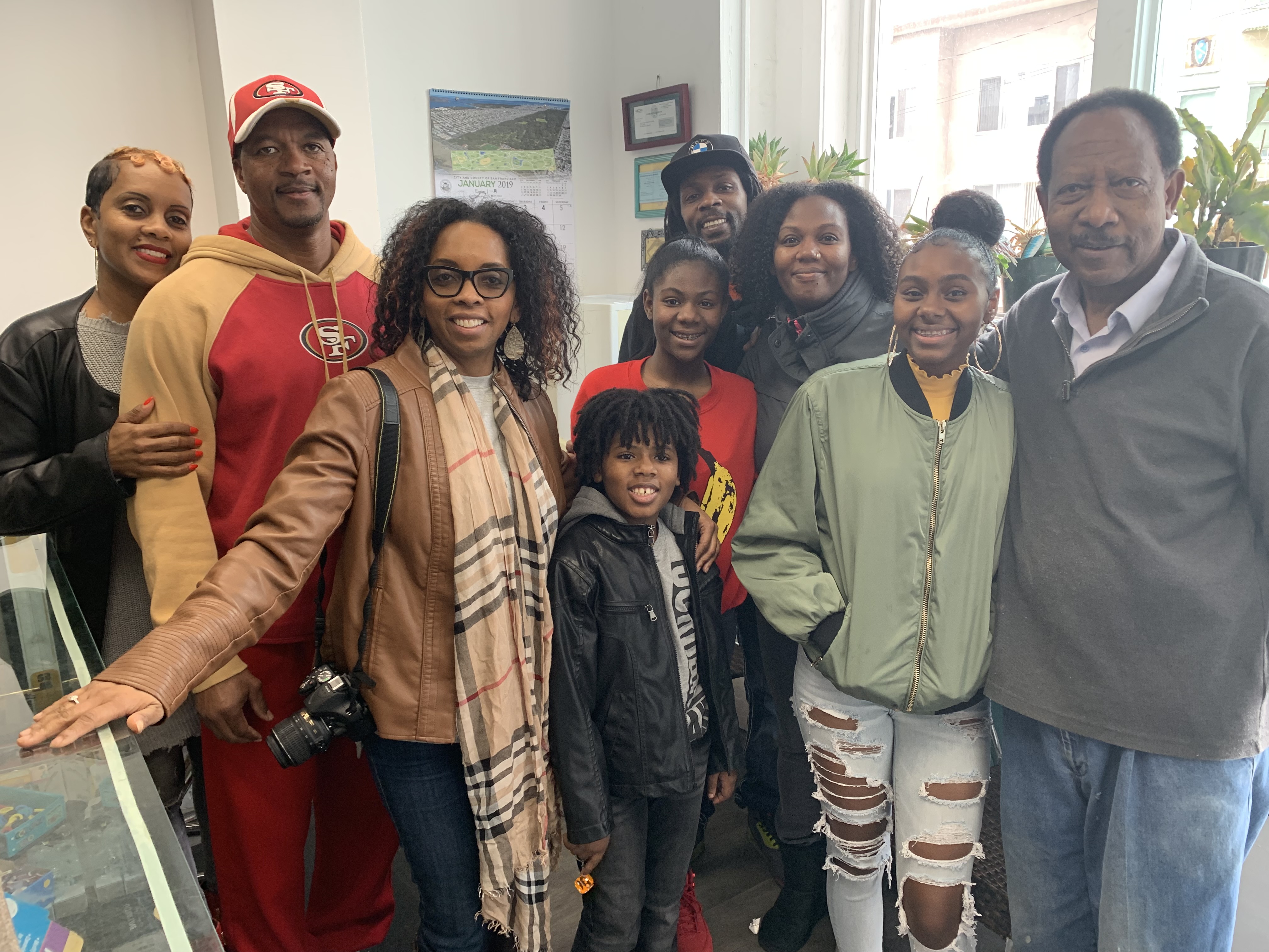 John White and his family for a group photo at the lockshop