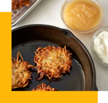 Latkes cooking in cast iron pan